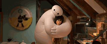 Hiro Hamada embraces his robot friend Baymax in a scene from the animated film Big Hero 6