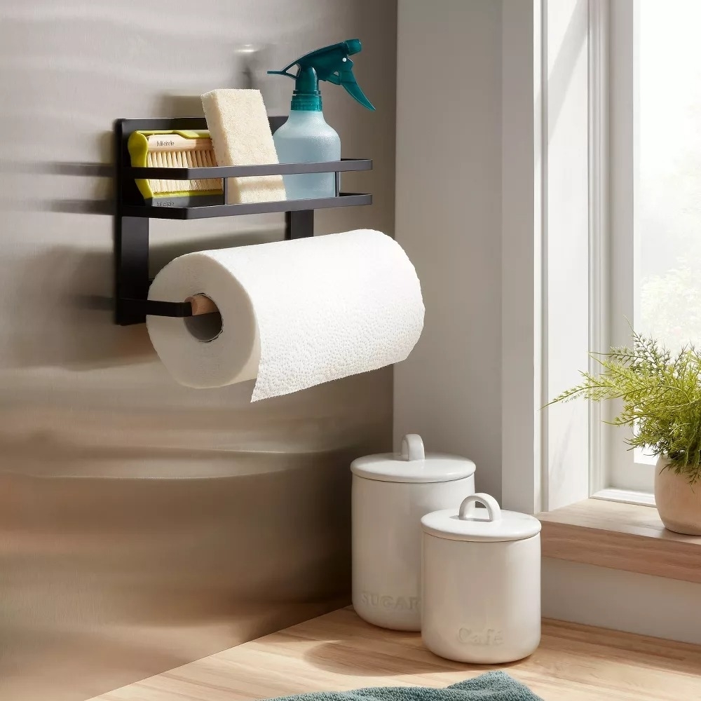 Magnetic paper towel holder with an attached shelf