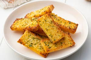 On the left, a plate of garlic bread