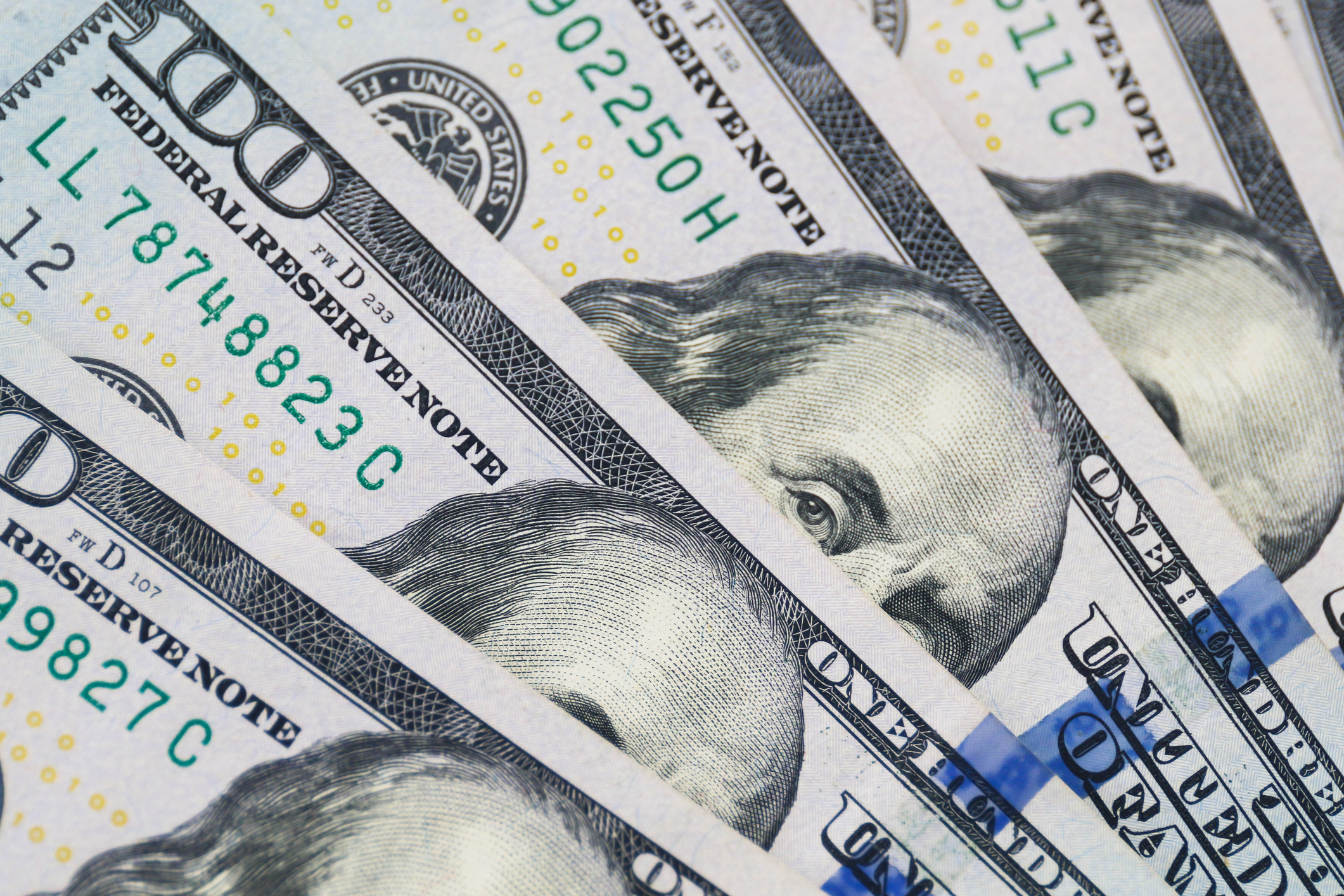 Close-up view of United States hundred-dollar bills in a stack