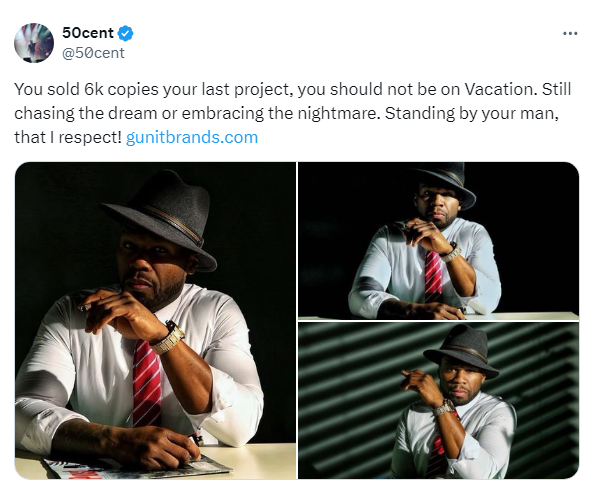 Rapper in fedora and suit gestures while sitting, with website link and tweet about music sales and dedication
