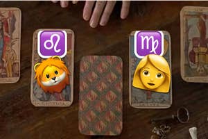 Tarot cards on a table are replaced with two Animoji faces, a lion and a girl, hinting at playfulness