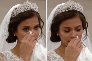 Bride in tiara and veil wiping away tears during an emotional moment