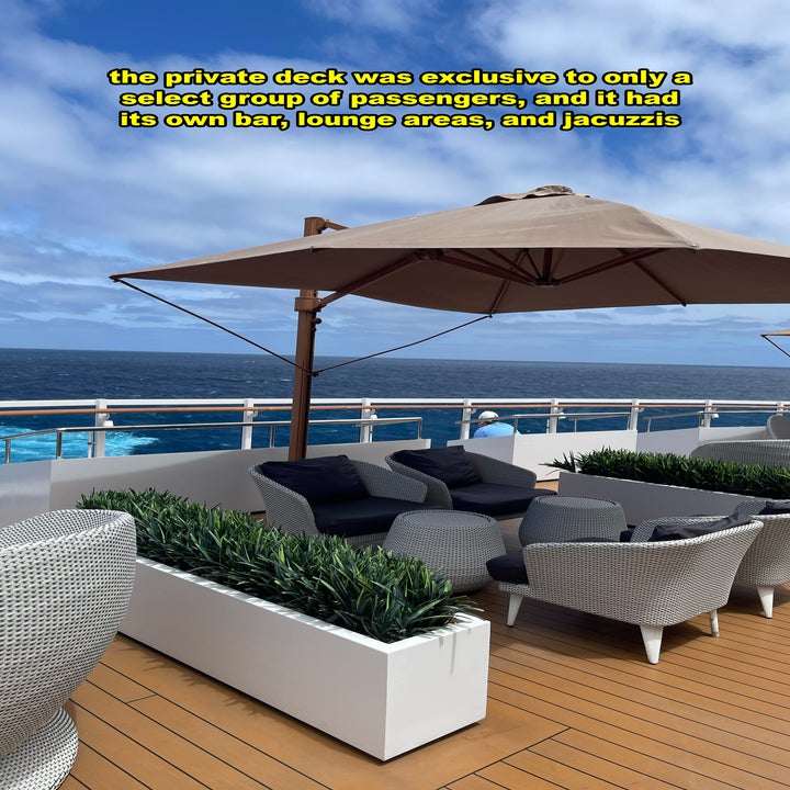 Cruise ship deck with seating area under an umbrella, next to text about exclusive amenities
