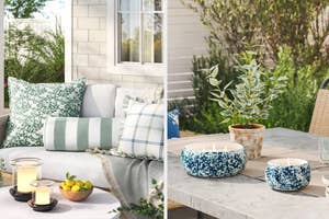 Outdoor patio setting with an assortment of decorative pillows and a cozy blanket; a table with candles, bowls, and a plant
