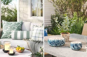 Outdoor patio setting with an assortment of decorative pillows and a cozy blanket; a table with candles, bowls, and a plant
