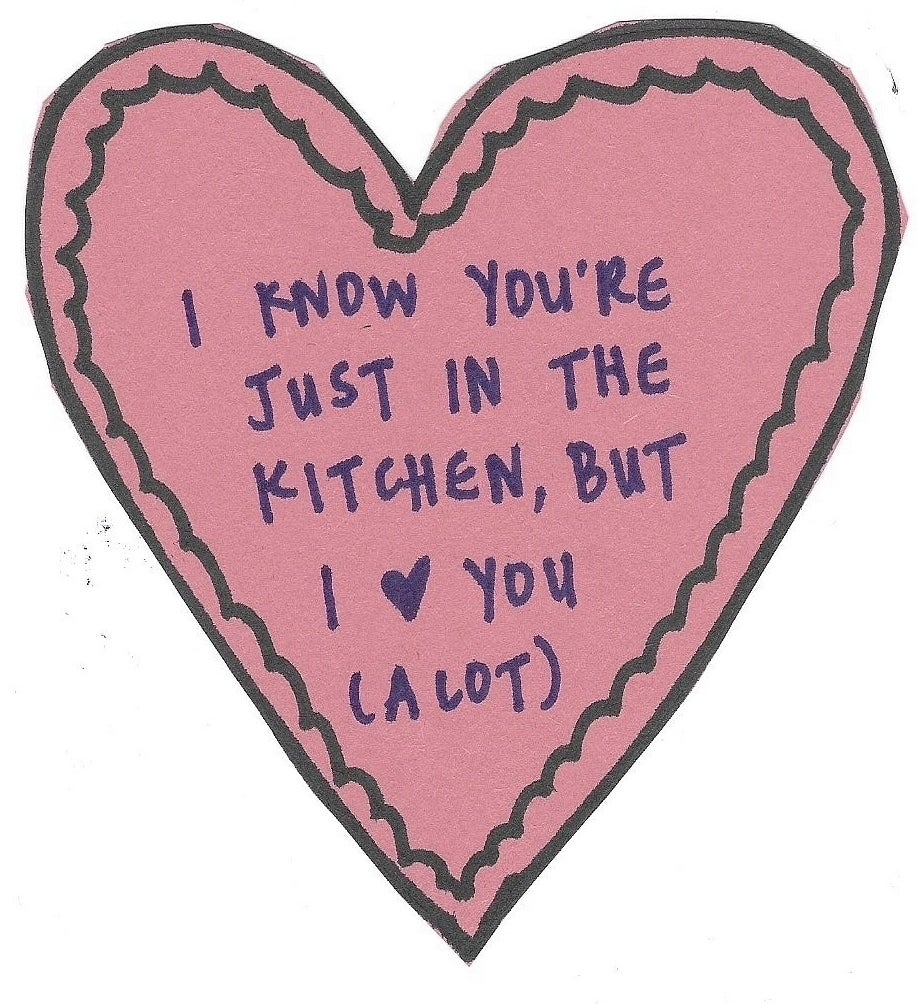 Heart-shaped illustration with handwritten note expressing affection for someone in another room