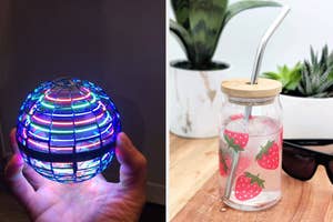 a glowing ball toy / a strawberry print glass with lid