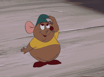 Gus, a plump animated mouse from Cinderella, wearing a yellow shirt, green hat, and red shoes