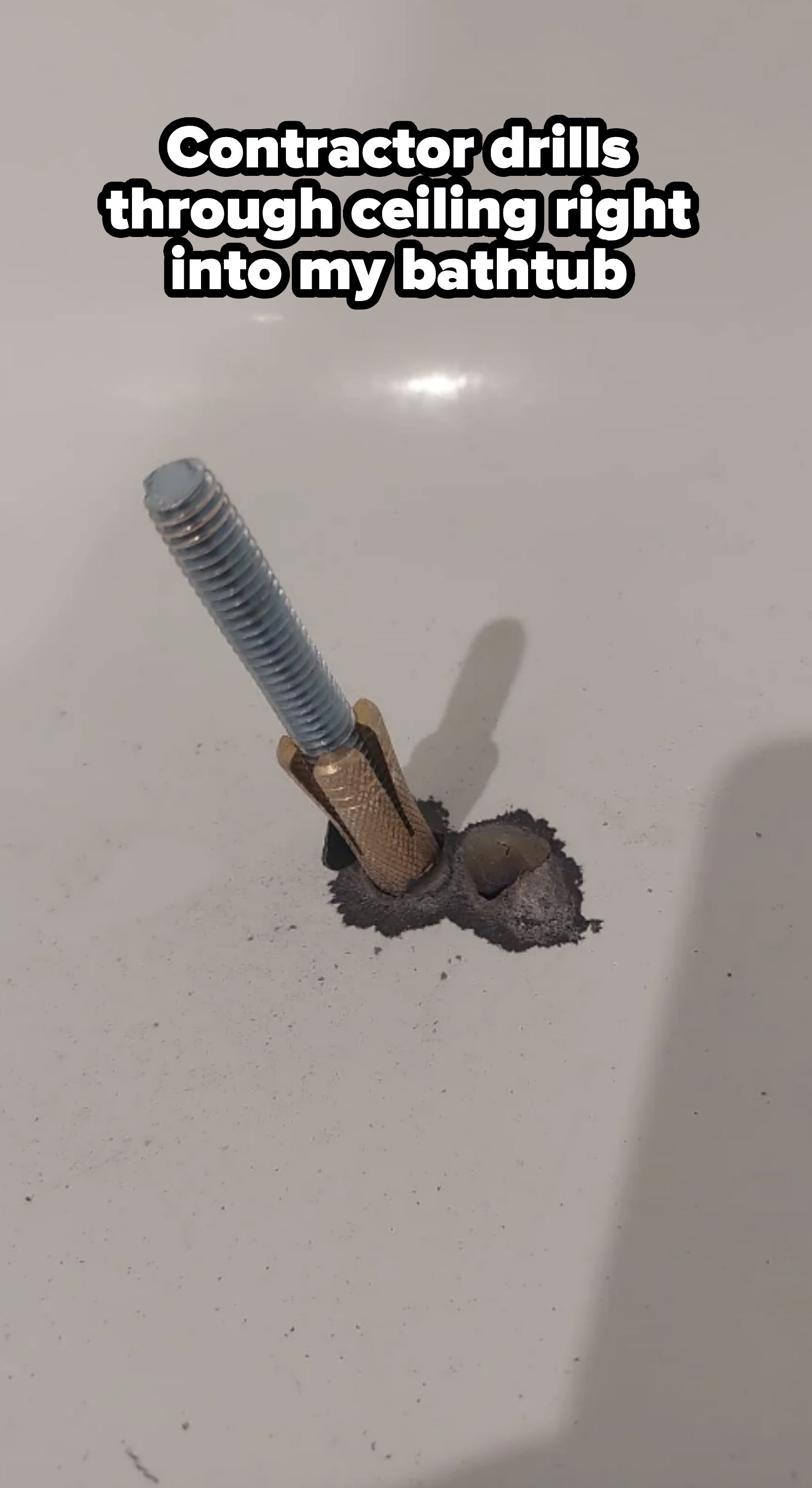 A damaged bathtub with a broken faucet and exposed pipe