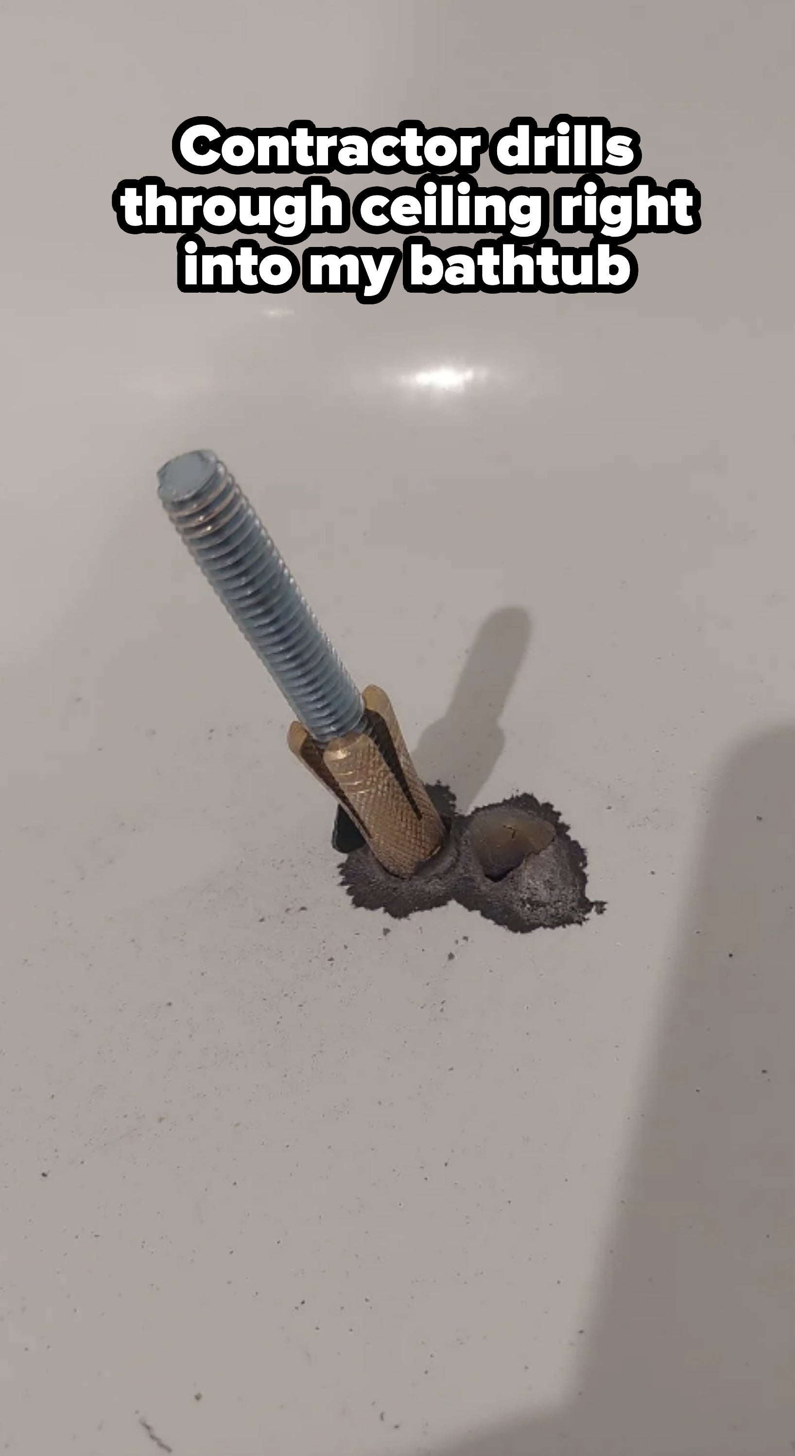 A damaged bathtub with a broken faucet and exposed pipe