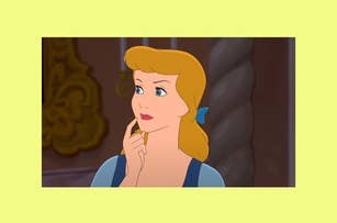 Cinderella, a drawn animated character, gazes thoughtfully to the side