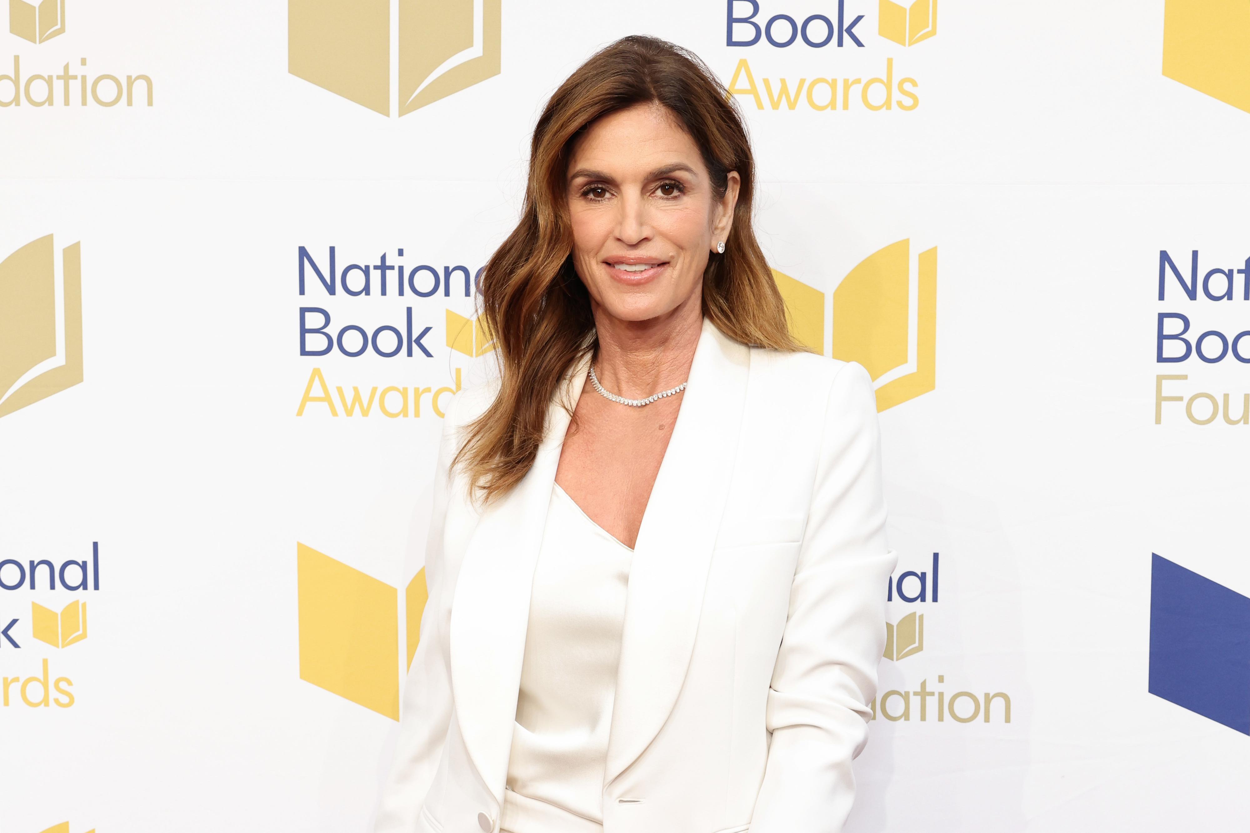 Cindy Crawford poses in a suit at the National Book Awards event