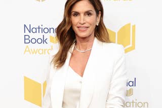 Cindy Crawford stepping out in a chic black blazer and matching skirt