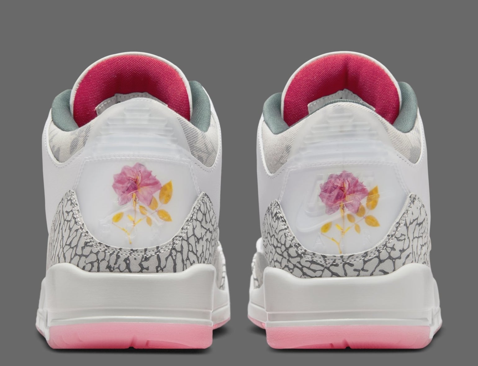 Rear view of a pair of sneakers with floral design on the heel