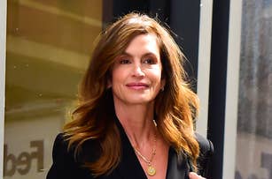 Cindy Crawford stepping out in a chic black blazer and matching skirt