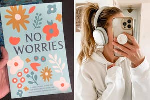 Person in white hoodie using headphones takes a mirror selfie holding a 'No Worries' journal