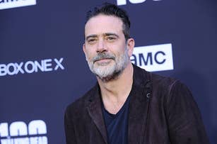 Jeffrey Dean Morgan in a velvet jacket poses at an event