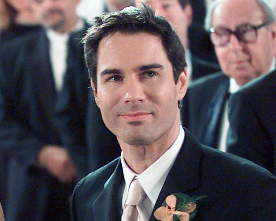 Actor in a tuxedo with a flower boutonniere at a formal event