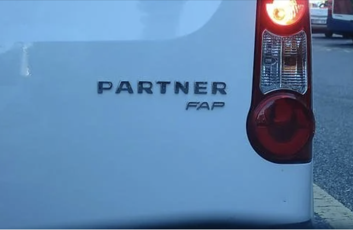 Rear view of a vehicle with "PARTNER FAP" text on the back