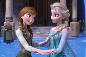 Anna and Elsa from Frozen, holding hands and smiling at each other