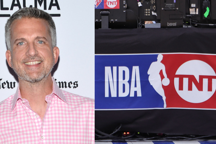 Bill Simmons smiles, sporting a checkered shirt at an event with NBA and TNT logos in the background