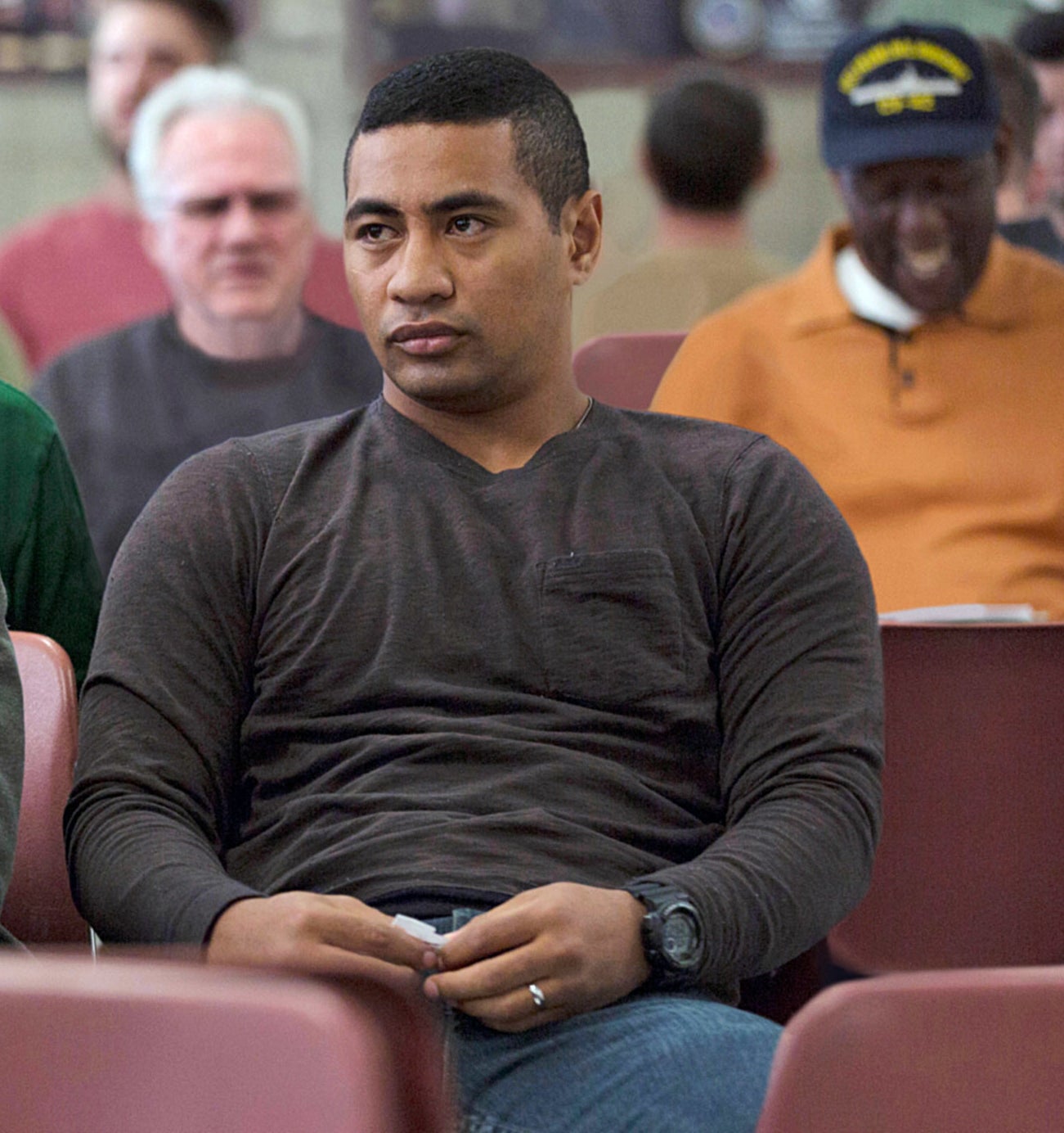 in a scene, Beulah as Solo, sitting in a row of chairs