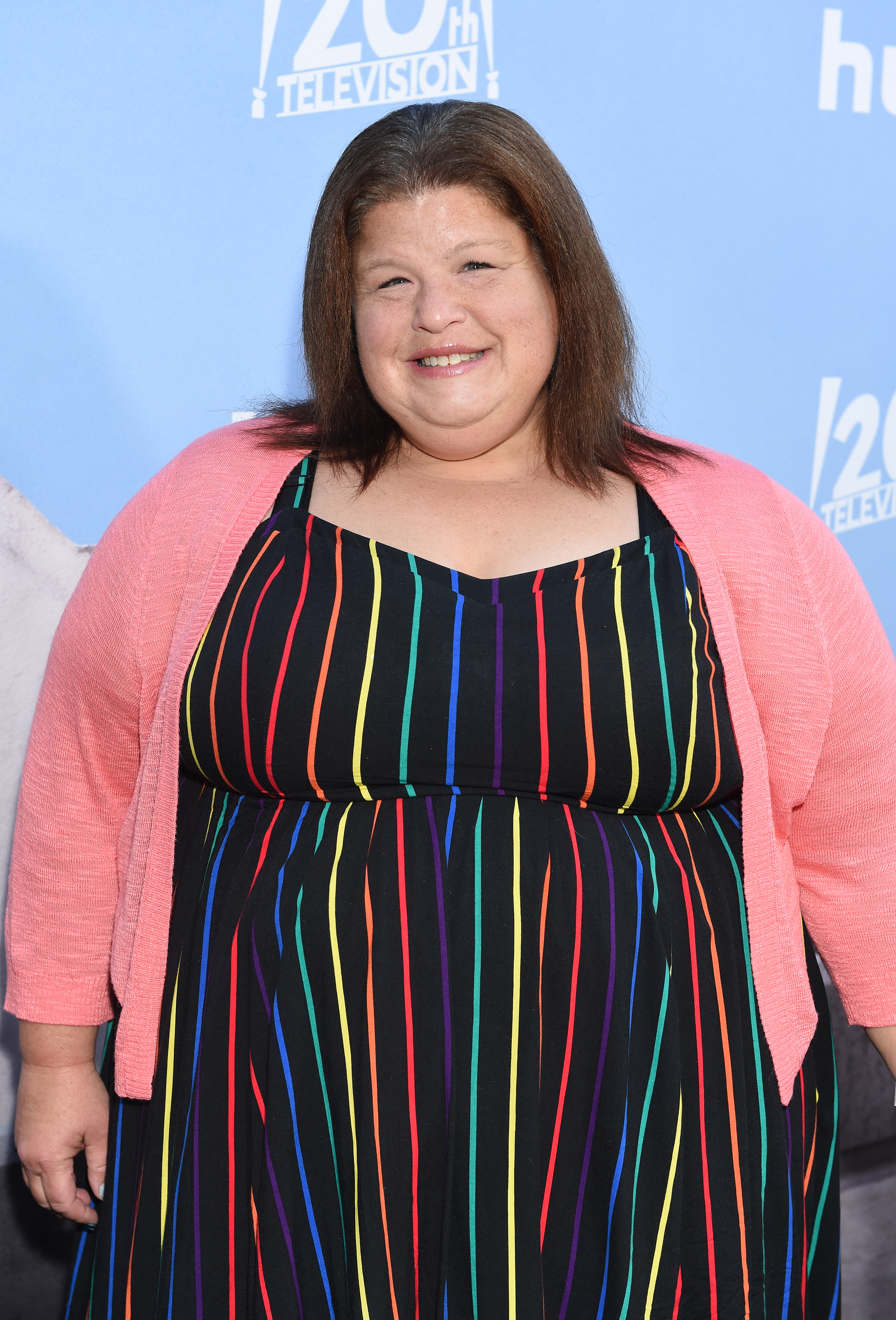 A closeup of Lori Beth Denberg smiling on the red carpet