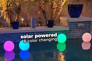 reviewer's pool with four inflatable lights "solar powered and color changing"