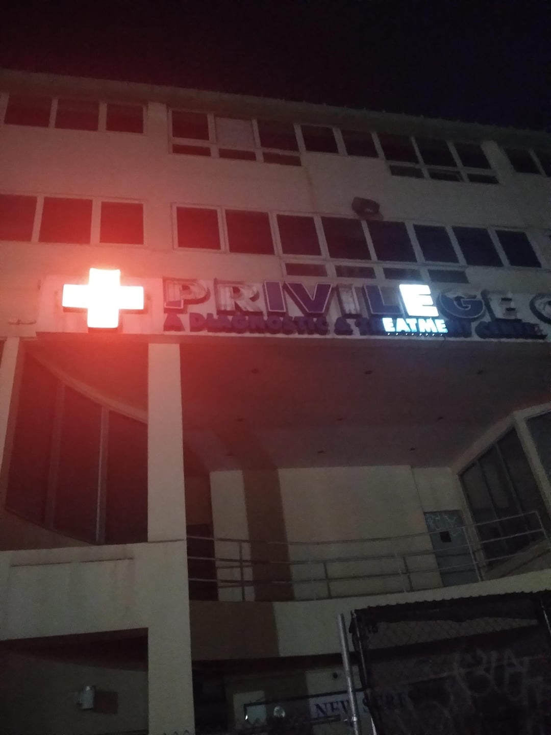 A treatment center with all letters burnt out except the ones that spell "eat me"