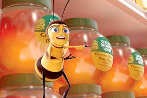 Barry B. Benson from Bee Movie, in front of honey jars, looking surprised