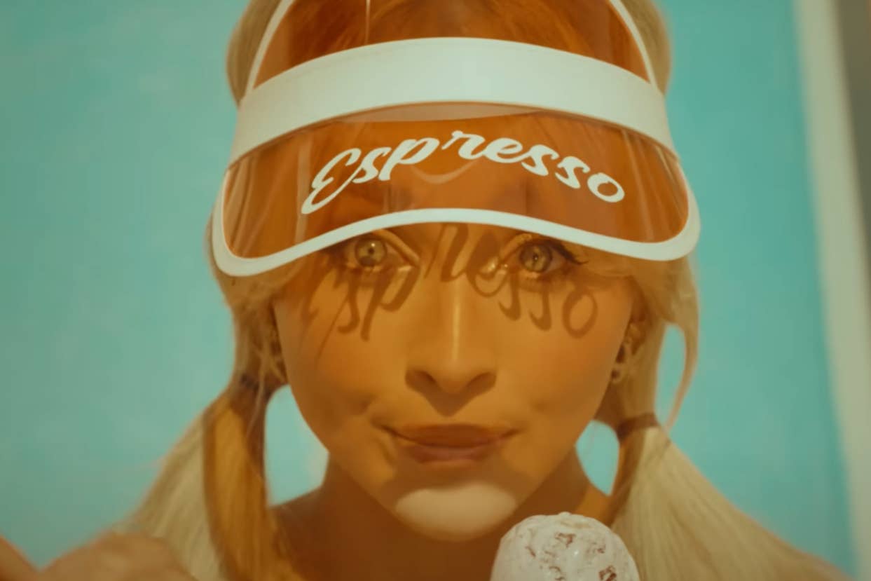 Sabrina Carpenter with visor labeled "Espresso" and pigtails