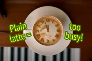 Cup of latte with a clock face design on foam, text overlaid says "Plain latte=too busy!"