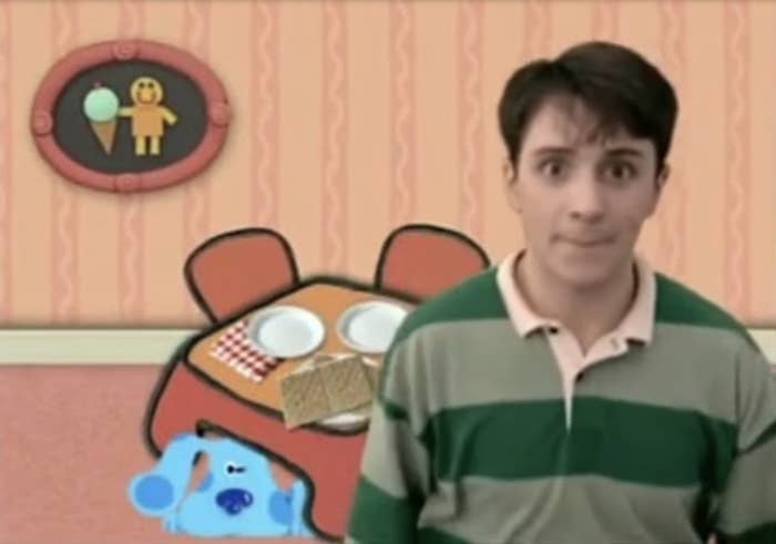 Steve from Blue&#x27;s Clues stands in a room with the animated character Blue and a thinking chair