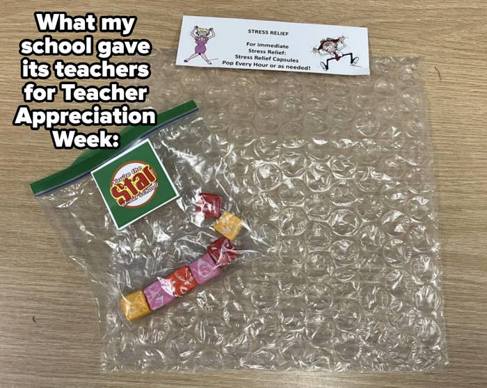 Stress relief items including bubble wrap, candy, and a playful card on a desk