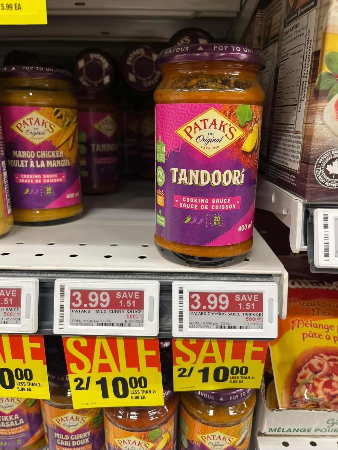 Jar of Patak's Tandoori sauce on a grocery shelf with a sale price tag displayed below it