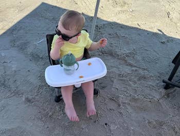 Toddler successful precocious seat connected formation with sunglasses and a sippy cup