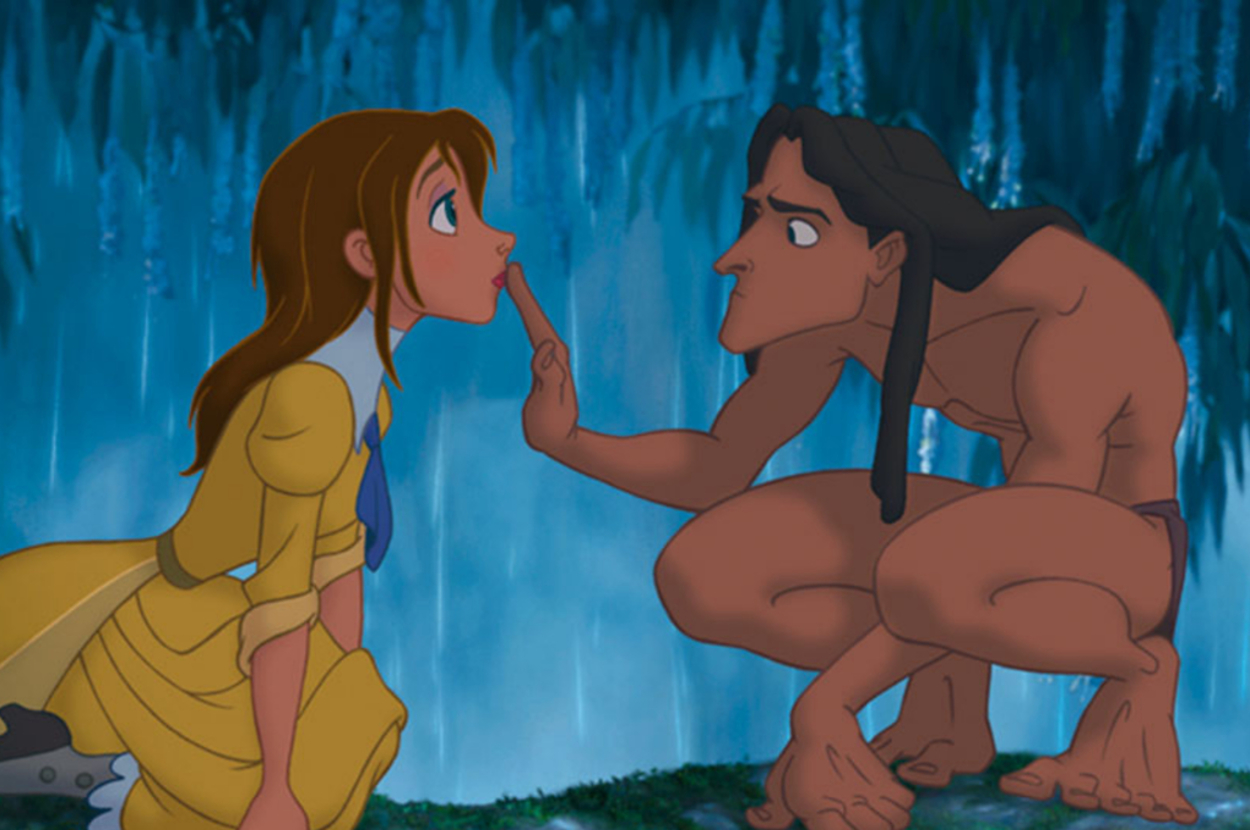 Animated characters Jane and Tarzan in a forest, Tarzan touching Jane's lips in a gesture of curiosity