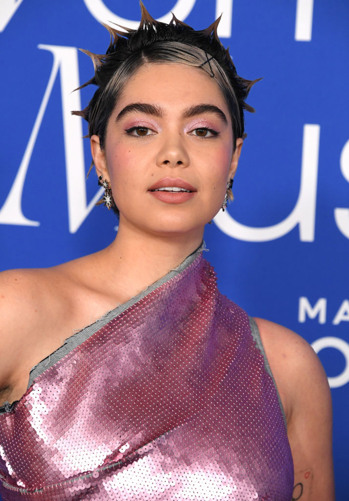 Auli'i in sequined attire with spiked hair at an event