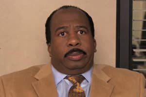 Stanley from "The Office" looking slightly bewildered or concerned