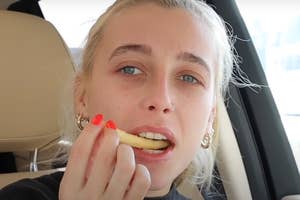 Emma Chamberlain eating a fry