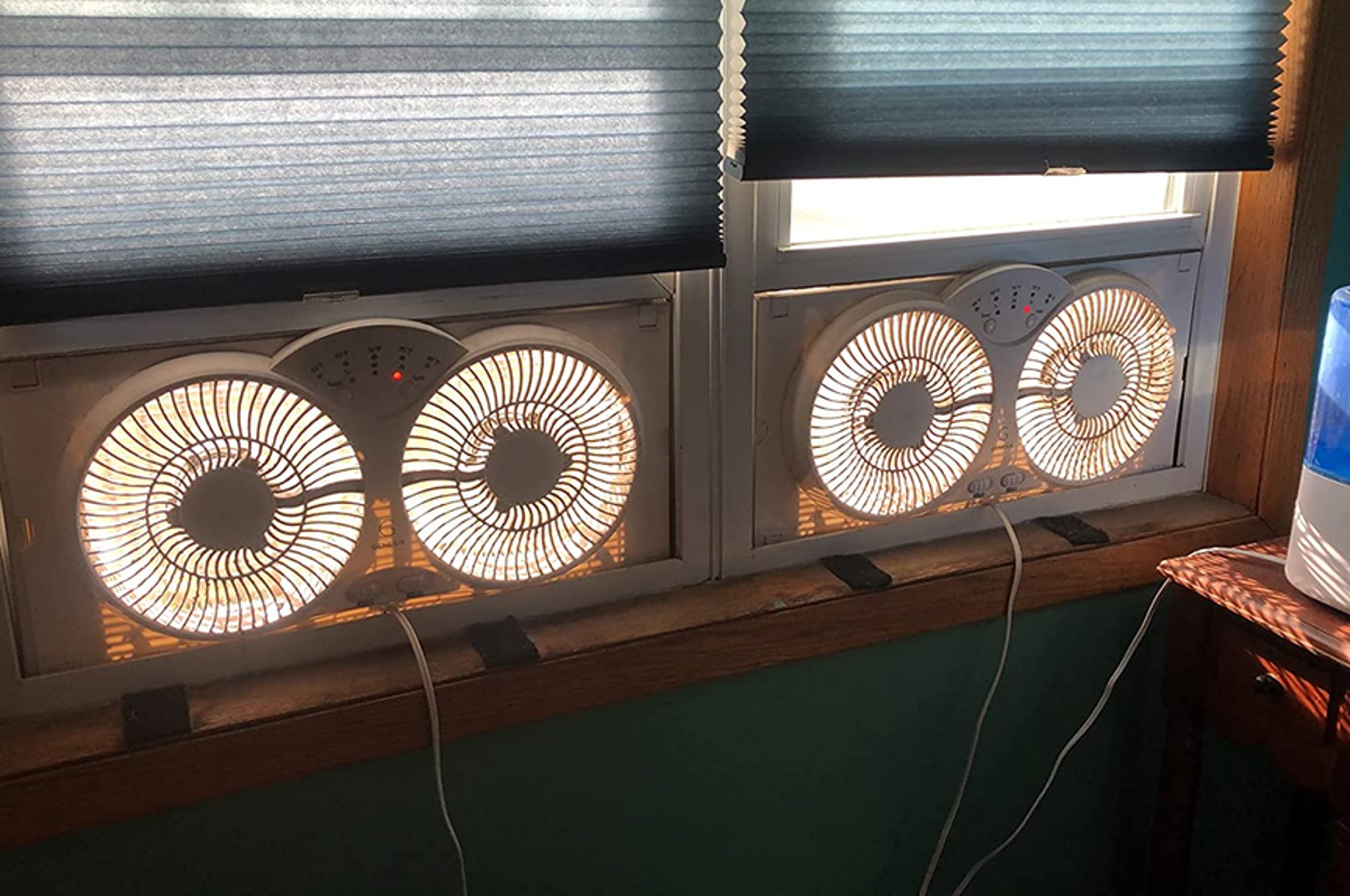 reviewer image of two window fans each in a window