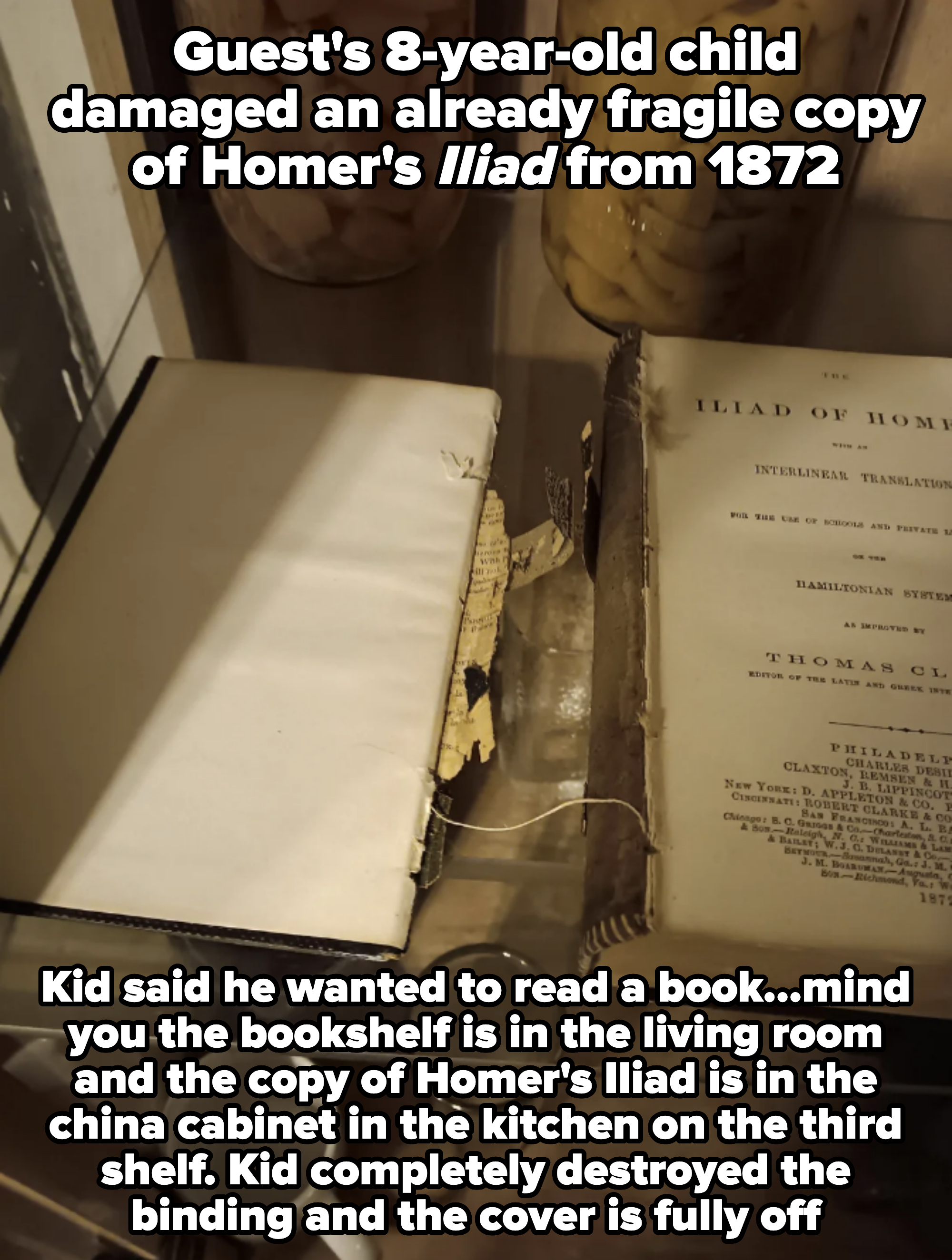 A weathered copy of Homer's Iliad on a shelf with other antique items and jars