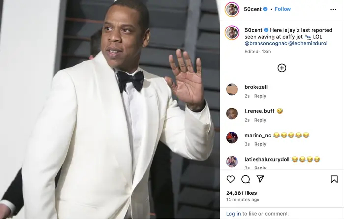 Jay-Z in a white tuxedo jacket waving, in a social media post with comments and likes visible