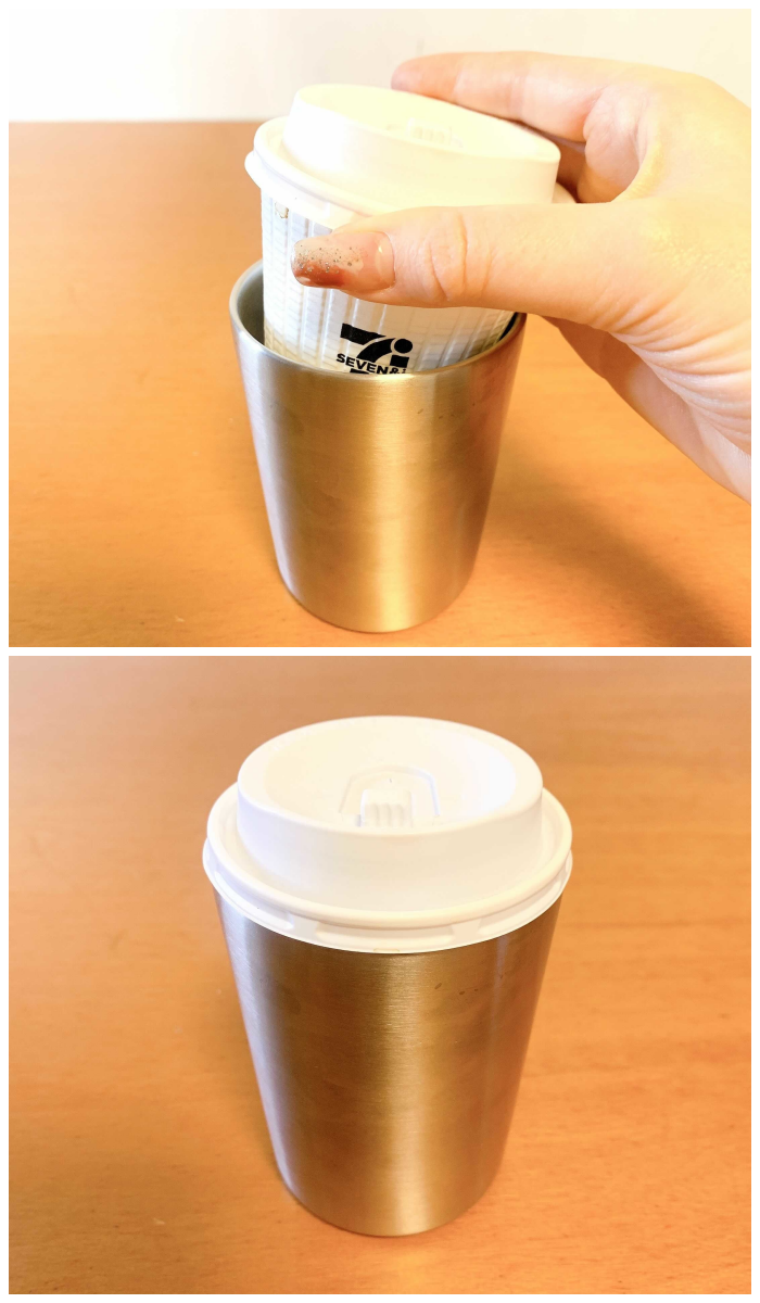 手で持ったステンレス製のカップと蓋