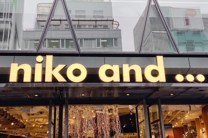 Storefront of &ldquo;niko and&hellip;&rdquo; with merchandise visible through large glass windows