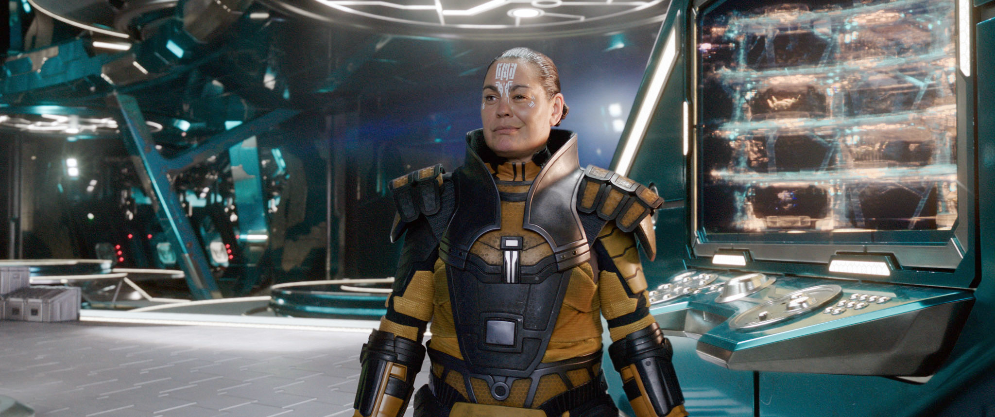Michelle Yeoh in a futuristic suit as Captain Philippa Georgiou from Star Trek: Discovery stands on a spaceship bridge
