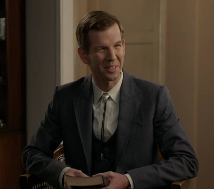 Jeff seated in a suit with his Bible in hand