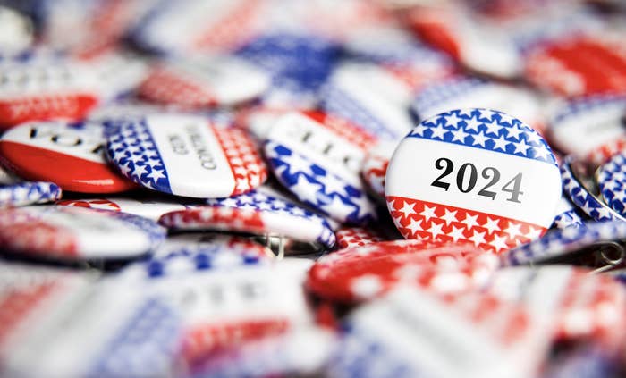Assorted campaign buttons with "2024" prominent, reflecting a political theme