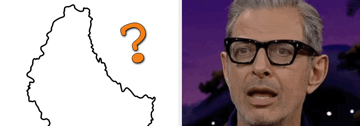 Jeff Goldblum wearing glasses and a striped shirt, with a puzzled expression; a stylized map of Luxembourg with a question mark